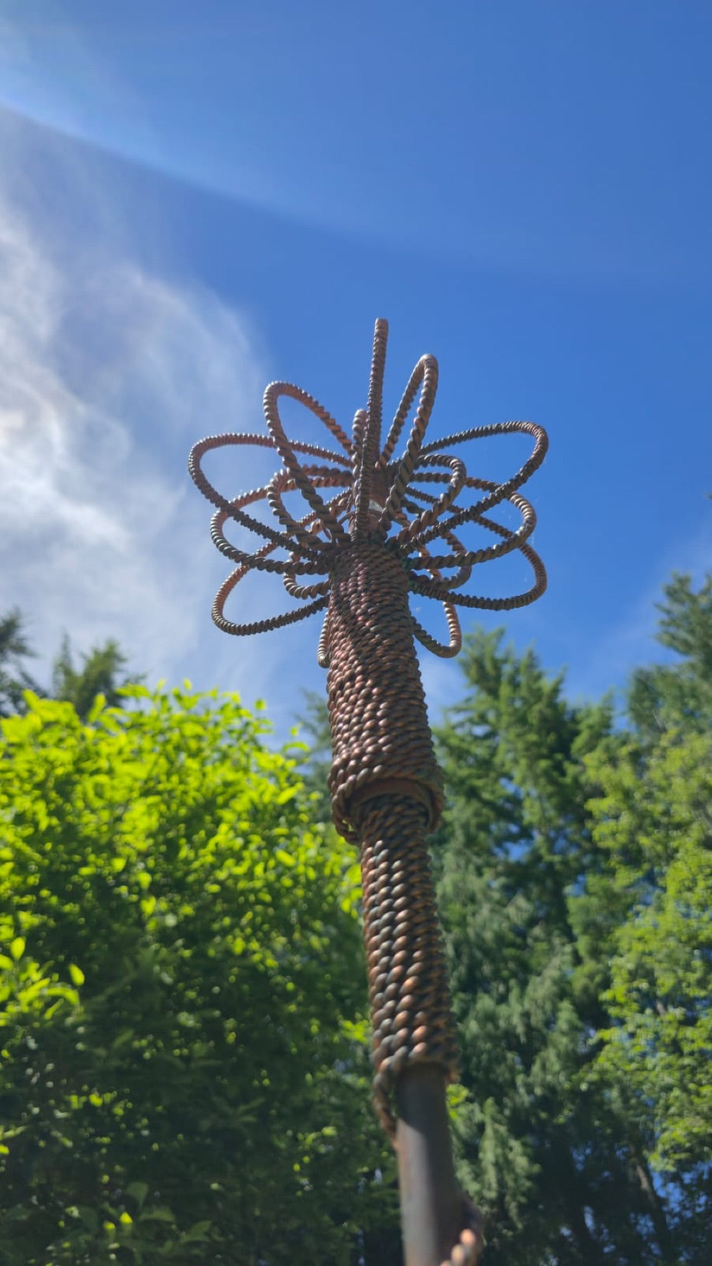 The copper crown set with quartz, lit like an artifact